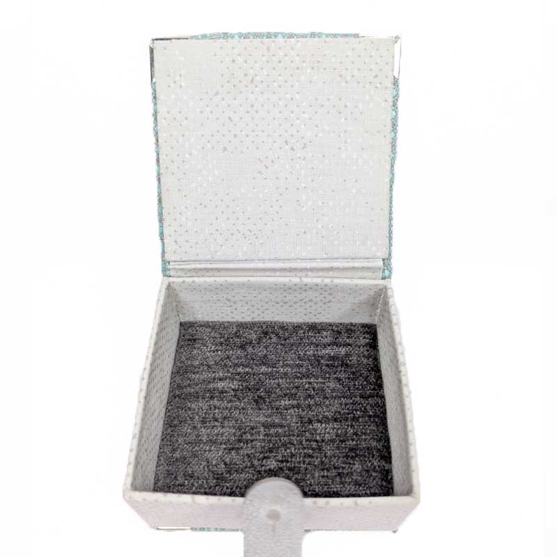 A square dice box with an open lid, featuring a textured silver glitter exterior, a light gray interior lining, and a dark gray plush-lined base.