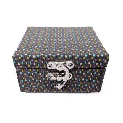 A rectangular fabric-covered storage box with a lid and a silver metal latch closure, featuring a dark charcoal gray woven pattern with small multicolored dots, shown on a plain white background.