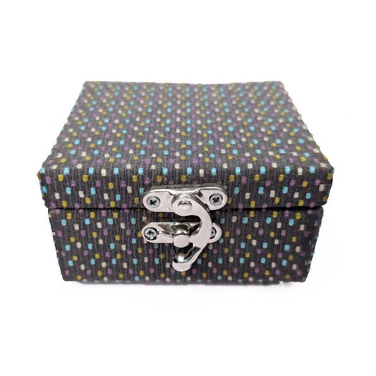 A rectangular fabric-covered storage box with a lid and a silver metal latch closure, featuring a dark charcoal gray woven pattern with small multicolored dots, shown on a plain white background.